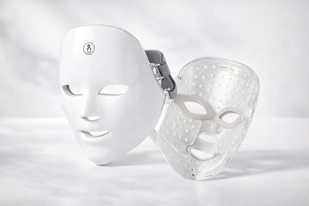 White LED face mask and clear face mask on a light gray background